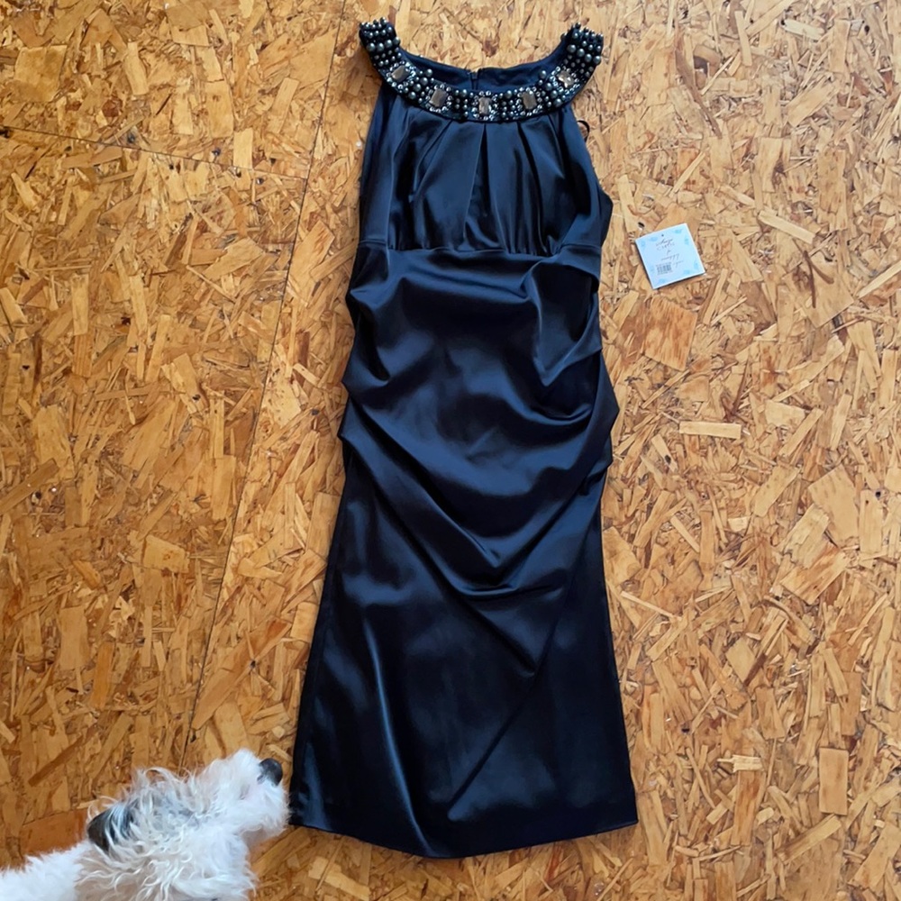 Black cocktail dress with decorative collar